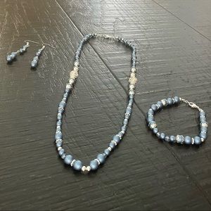 Handcrafted blue and silver beaded necklace, bracelet and earrings set.
